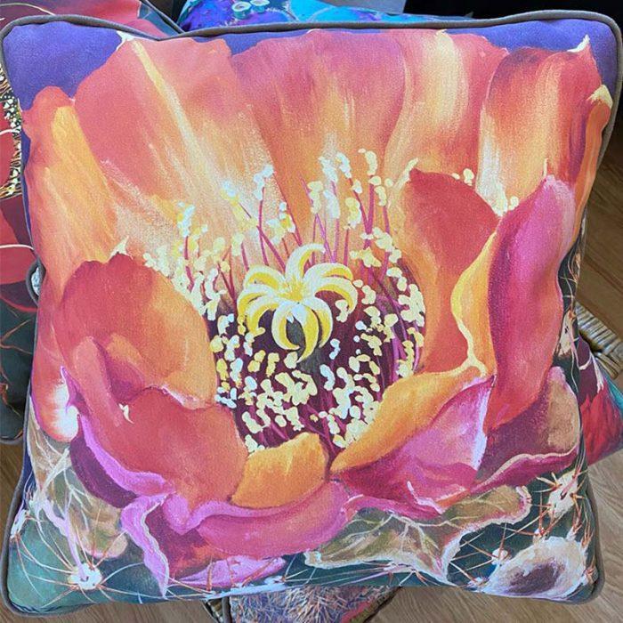 accent pillow with orange and pink flower